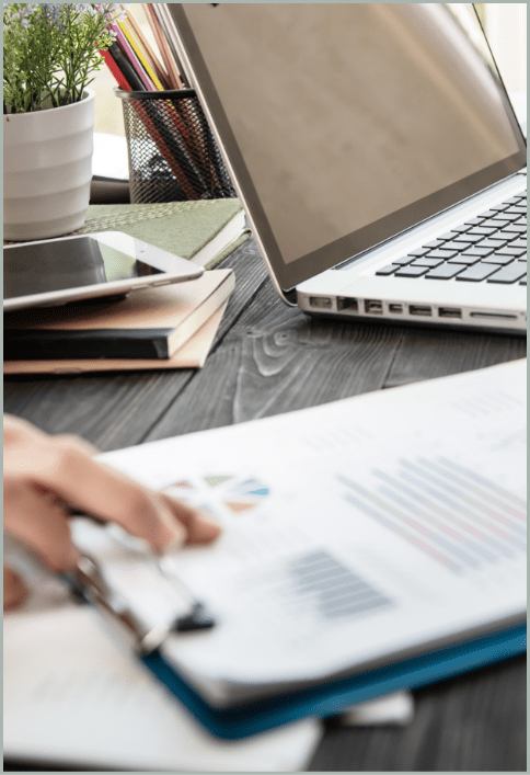 Professional using a laptop to analyze information, representing data processing, analytics and electronic discovery workflows.